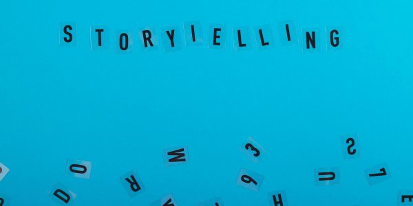 Storytelling is written on a light blue background among black letters. Marketing and content